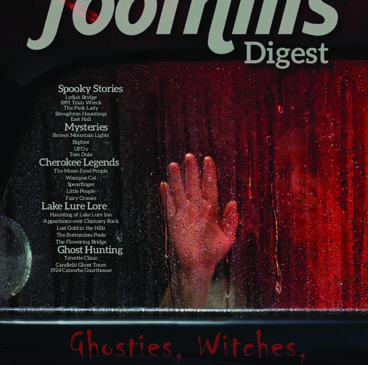 A hand pressed against the rain-covered window of a car, illuminated red — cover of Foothills Digest's Ghosties, Witches, Haints & Spirits issue